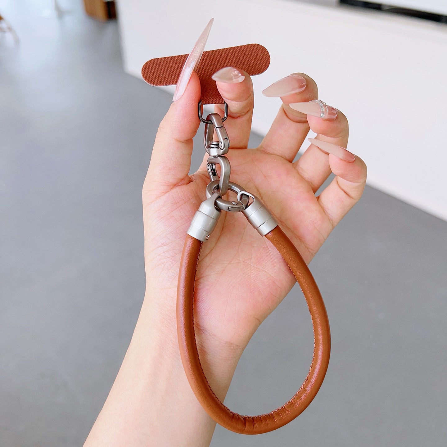 PU Leather Rotatable Wrist Phone Strap with Tether Tabs – High Intensity Wristlet & Hand Lanyard